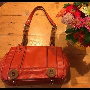 Milly handbag with torti & strap and button style